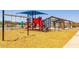 A ground-level image featuring a playground with swings, slides, climbing structures, and a shaded picnic area at 12651 W Parkway Ln, Avondale, AZ 85323