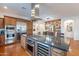 Kitchen featuring stainless steel appliances, a wine cooler, and an island with a cooktop at 1275 E Verde Blvd, Queen Creek, AZ 85140