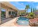 Inviting pool area with a pergola, seating, and well-manicured landscaping at 1275 E Verde Blvd, Queen Creek, AZ 85140