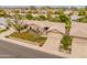 An elevated view capturing this home's manicured front yard, attached garage, and a well-designed outdoor at 13026 W Peach Blossom Dr, Sun City West, AZ 85375