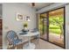 Charming breakfast nook features stylish seating and a sliding door with serene view of the outdoor space at 13026 W Peach Blossom Dr, Sun City West, AZ 85375