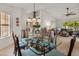 Stylish dining area blends seamlessly with the living room, creating a spacious and welcoming atmosphere at 13026 W Peach Blossom Dr, Sun City West, AZ 85375