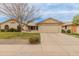 Charming single-story home featuring a well-maintained front yard, mature tree, and a spacious two-car garage at 13026 W Peach Blossom Dr, Sun City West, AZ 85375