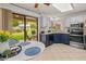 Bright kitchen with stainless steel appliances and a sliding glass door to the outdoor patio at 13026 W Peach Blossom Dr, Sun City West, AZ 85375