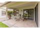 Covered patio area with outdoor seating, perfect for relaxing and entertaining guests at 13026 W Peach Blossom Dr, Sun City West, AZ 85375