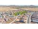 Neighborhood aerial showcasing homes, park, and the scenic mountain views at 1316 E Spencer St, Casa Grande, AZ 85122