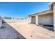 Backyard featuring a covered patio and a high block fence at 1316 E Spencer St, Casa Grande, AZ 85122