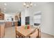 Bright eat-in kitchen area with stainless steel appliances, a black refrigerator, and natural light at 1316 E Spencer St, Casa Grande, AZ 85122