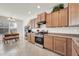 Functional kitchen with full cabinets, stainless steel appliances and eat-in dining area at 1316 E Spencer St, Casa Grande, AZ 85122