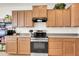 Well-equipped kitchen featuring stainless steel appliances and ample cabinet space at 1316 E Spencer St, Casa Grande, AZ 85122