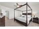 Bright main bedroom featuring a four post bed, neutral walls, and ceiling fan at 1316 E Spencer St, Casa Grande, AZ 85122