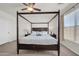 Main bedroom with a four post bed, bedside tables and ceiling fan at 1316 E Spencer St, Casa Grande, AZ 85122