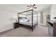 Bright main bedroom featuring a four post bed, neutral walls, and carpet floors at 1316 E Spencer St, Casa Grande, AZ 85122