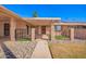 Welcoming front porch featuring a decorative iron gate, brick accents, and a well-maintained walkway at 13621 N Emberwood Dr, Sun City, AZ 85351