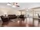 Spacious living room offers ample seating, a ceiling fan, and sliding glass doors for natural light at 13621 N Emberwood Dr, Sun City, AZ 85351