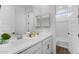 Bathroom showcasing double vanity sinks, mirrors and a shower with glass door at 14315 W Calle Lejos Rd, Surprise, AZ 85387
