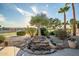 Backyard featuring a rock water feature and desert landscaping at 15131 W Daybreak Dr, Surprise, AZ 85374