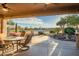 View from the covered patio of the lush golf course and desert landscape at 15131 W Daybreak Dr, Surprise, AZ 85374