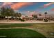 Sunset view of home from golf course tee box at 15131 W Daybreak Dr, Surprise, AZ 85374