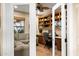 View of a home office with custom built-ins, a comfortable seating area, and abundant natural light at 15131 W Daybreak Dr, Surprise, AZ 85374