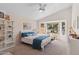 Cozy bedroom with natural light from the bay window, neutral decor, and a vaulted ceiling with ceiling fan at 17077 N Zuni Trl, Surprise, AZ 85374