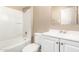 Bathroom with a shower-tub combo, and a white vanity with a large mirror at 1736 E Coronado Rd, Phoenix, AZ 85006