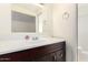 Bathroom vanity features dark wood cabinets, a white countertop, and a mirror at 1736 E Coronado Rd, Phoenix, AZ 85006