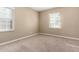 Bedroom with neutral carpet and dual windows at 1736 E Coronado Rd, Phoenix, AZ 85006