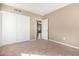 Spacious bedroom featuring neutral carpet and a double closet at 1736 E Coronado Rd, Phoenix, AZ 85006