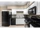 Kitchen featuring appliances, backsplash and tile flooring at 1736 E Coronado Rd, Phoenix, AZ 85006