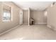 Unfurnished living room with tile floors, bright windows, and entry door at 1736 E Coronado Rd, Phoenix, AZ 85006