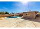 Backyard featuring a blue swimming pool and concrete patio with a clear blue sky above at 1736 E Coronado Rd, Phoenix, AZ 85006