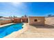 Backyard featuring a blue swimming pool and a mix of architectural styles around the perimeter at 1736 E Coronado Rd, Phoenix, AZ 85006