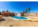 The backyard features a pool surrounded by various structures and desert landscaping at 1736 E Coronado Rd, Phoenix, AZ 85006