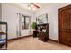 Charming bedroom with a ceiling fan and a bright window for natural light at 18332 W Latham St, Goodyear, AZ 85338