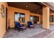 Inviting patio seating area under a covered space, perfect for enjoying the outdoors at 18332 W Latham St, Goodyear, AZ 85338