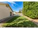 Backyard with artificial turf, pavers, gravel, and lush greenery, perfect for outdoor enjoyment at 1938 E Myrna Ln, Tempe, AZ 85284