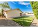 Beautiful backyard with artificial turf, pavers, gravel, and an inviting pool for relaxation and entertainment at 1938 E Myrna Ln, Tempe, AZ 85284