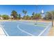 Outdoor basketball court featuring vibrant blue and green paint on a sunny day at 1938 E Myrna Ln, Tempe, AZ 85284