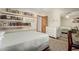 Bedroom with bookshelves, closet, dresser, and a window with natural light at 1938 E Myrna Ln, Tempe, AZ 85284