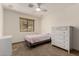 Cozy bedroom featuring a window, dresser, carpet, and a ceiling fan at 1938 E Myrna Ln, Tempe, AZ 85284