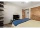 Bedroom features a TV, closet, and a sporty basketball hoop hung on the doorway for entertainment at 1938 E Myrna Ln, Tempe, AZ 85284