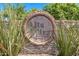 Stone sign for the Alta Mira community with lush green plants at 1938 E Myrna Ln, Tempe, AZ 85284