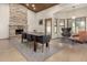 Spacious dining room with stone fireplace, wood-paneled ceiling, and comfortable seating at 1938 E Myrna Ln, Tempe, AZ 85284