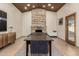 Elegant dining room with stone fireplace, wood-paneled ceiling, and neutral color palette at 1938 E Myrna Ln, Tempe, AZ 85284