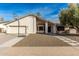 Inviting single-story home with desert landscaping, a basketball hoop, a stucco facade, and a two-car garage at 1938 E Myrna Ln, Tempe, AZ 85284