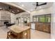 Spacious kitchen featuring wooden cabinets, granite countertops, and an island with seating at 1938 E Myrna Ln, Tempe, AZ 85284