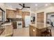 Functional kitchen featuring wood cabinets, granite countertops, and modern appliances at 1938 E Myrna Ln, Tempe, AZ 85284