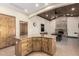 View of the kitchen island, stone fireplace, and dining area in the background at 1938 E Myrna Ln, Tempe, AZ 85284