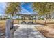 Outdoor park pavilion featuring picnic tables and a drinking fountain on a sunny day at 1938 E Myrna Ln, Tempe, AZ 85284